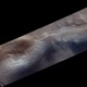 Layered mounds near a crater.